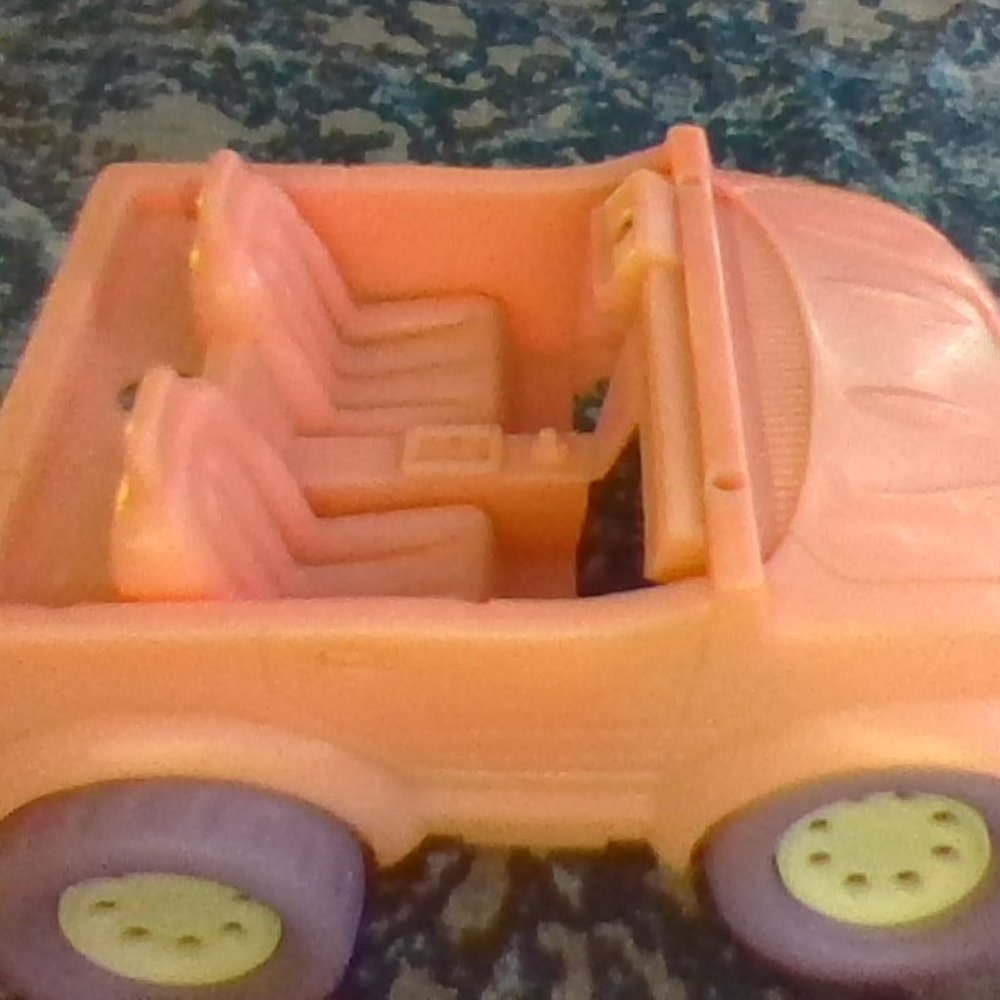 a pink kids toy car